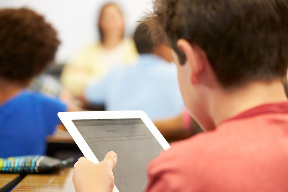 Students working at computers in a library